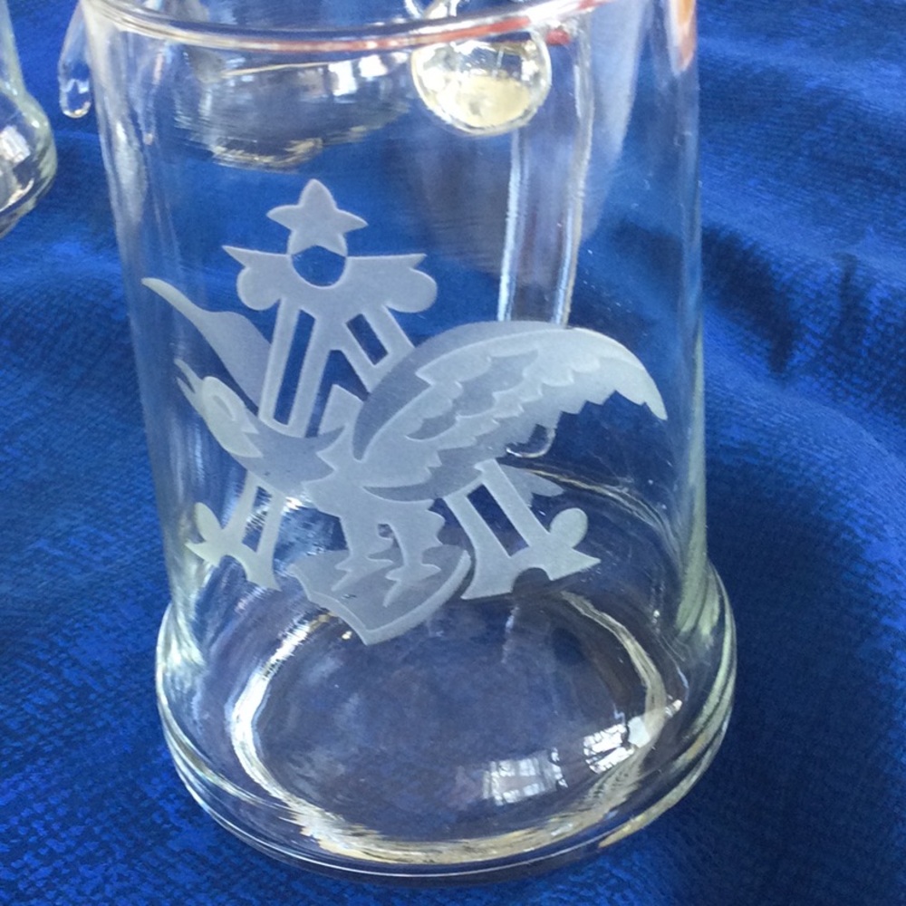 Set of four hand carved glass tankards with Anheisher-Busch eagle image